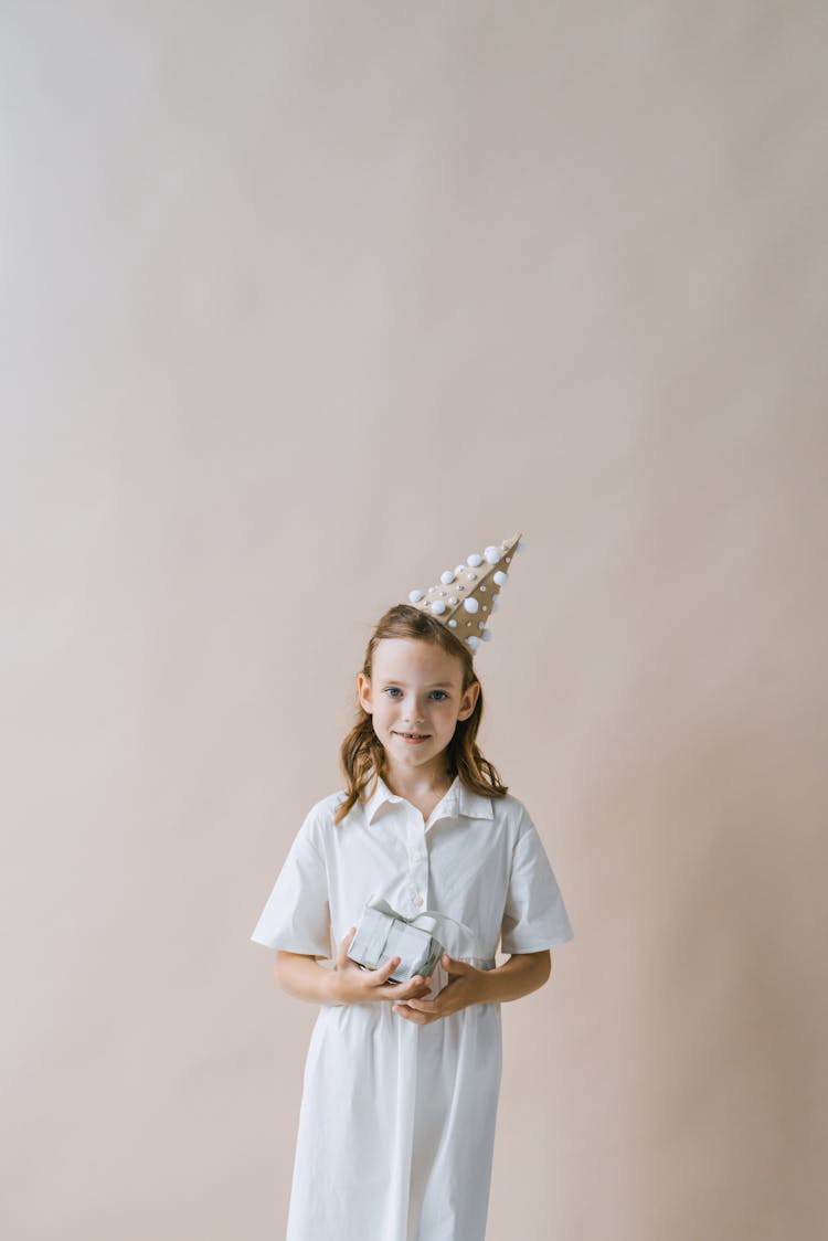 A Girl Holding A Gift 