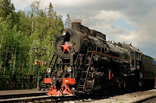 Black and Red Train on Rail Tracks