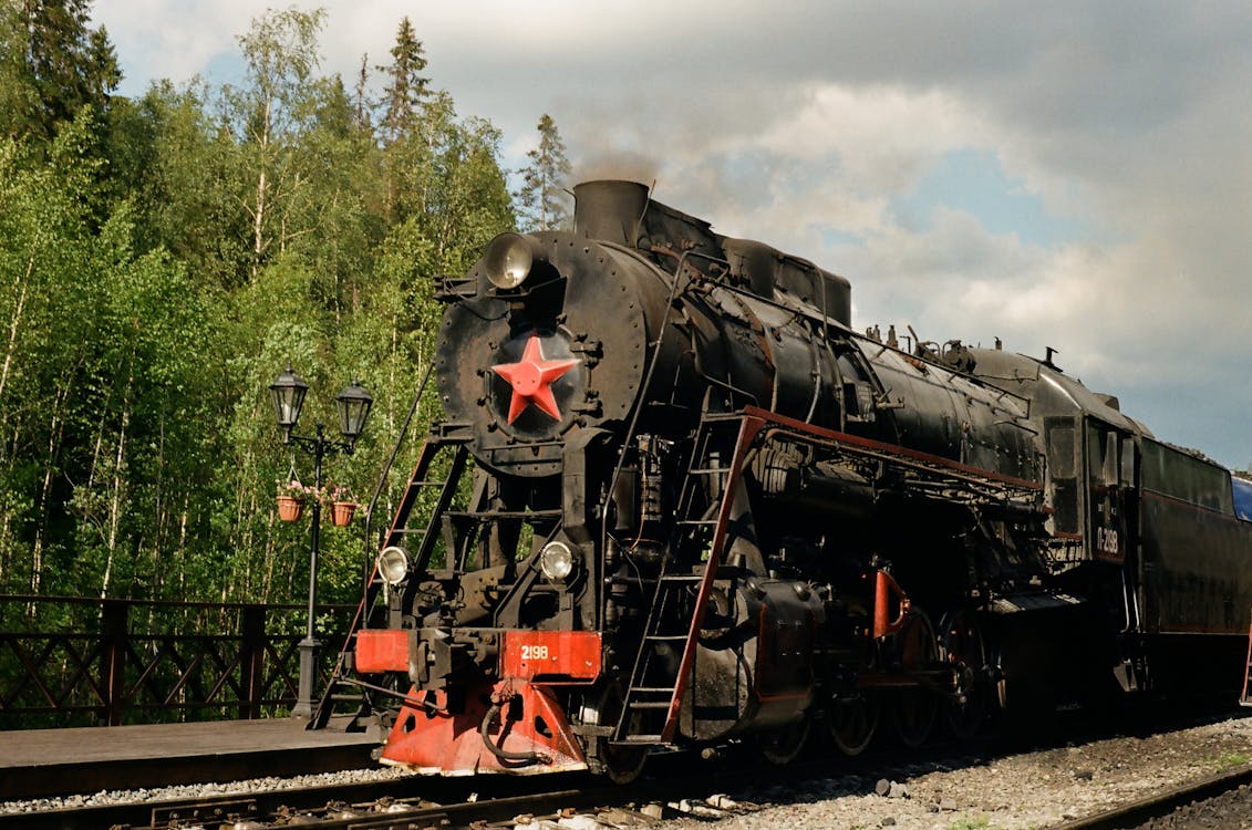 Black and Red Train on Rail Tracks