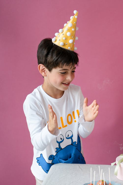 Free A Young Boy Wearing Party Hat Stock Photo
