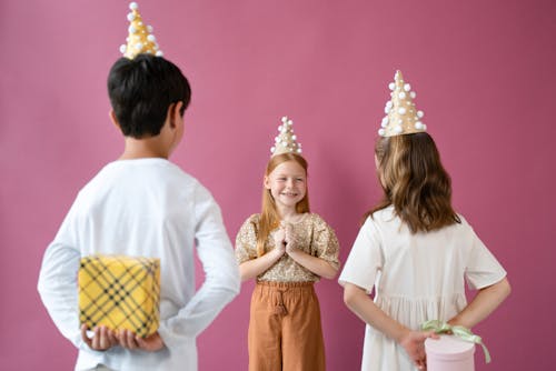 Free Kids Giving a Girl Gifts Stock Photo