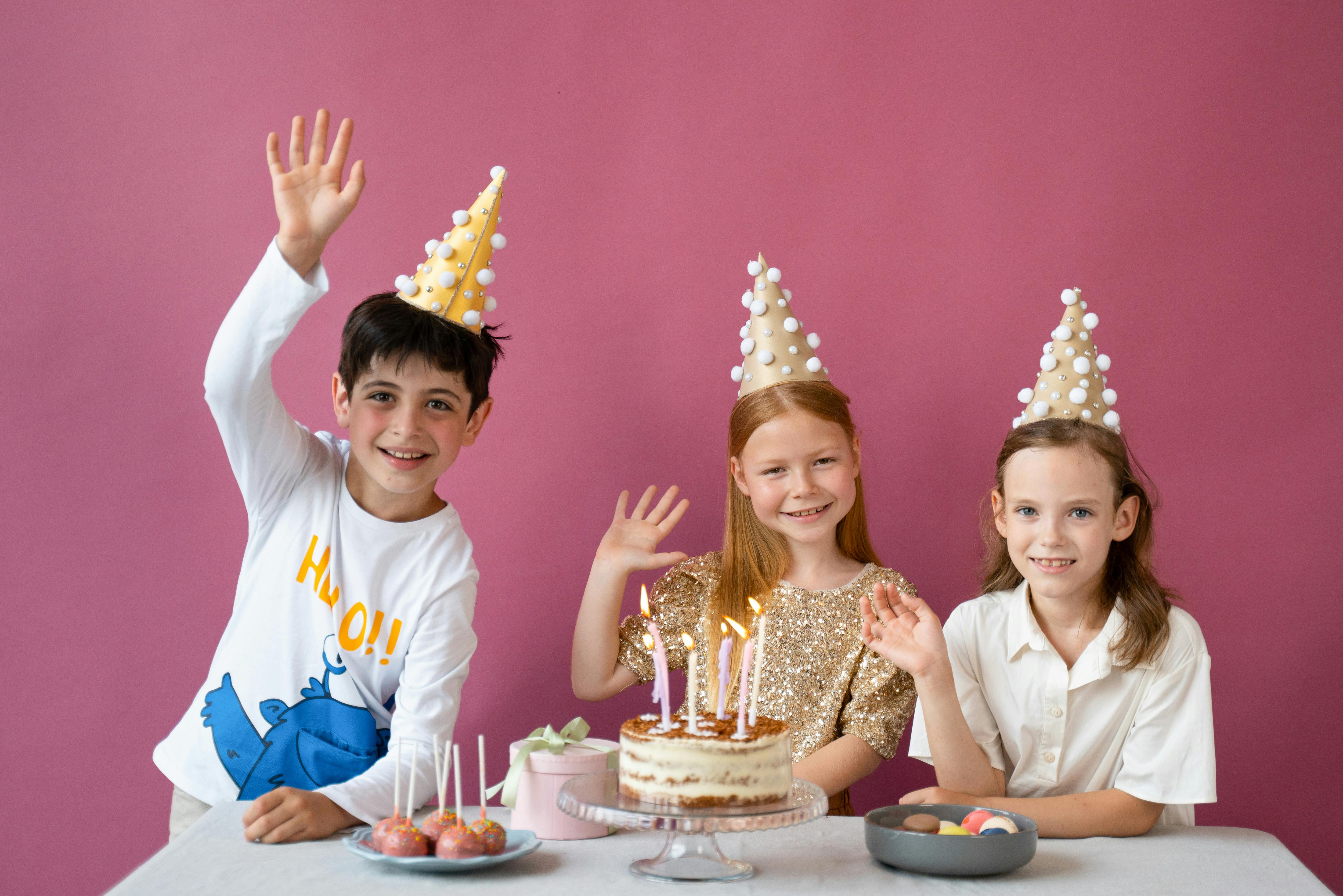 children wearing party hats