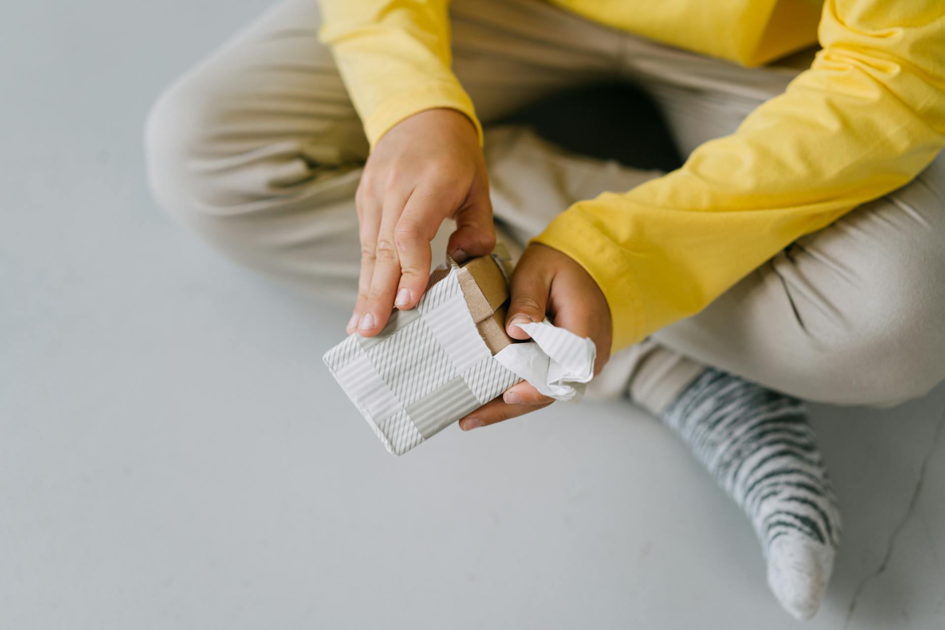 A Person Unwrapping a Gift