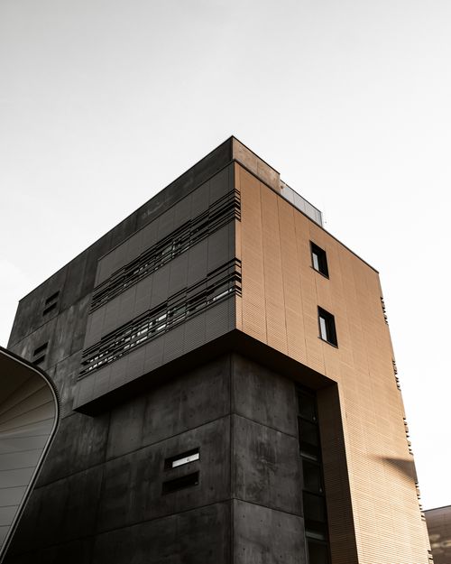 Free Modern urban building exterior with a minimalist facade from a low angle perspective. Stock Photo