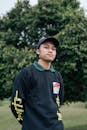 Boy in Blue and Yellow Nike Crew Neck Shirt and Black Cap