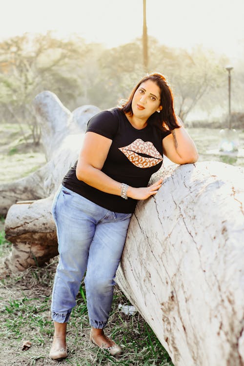 Woman Wearing Casual Clothing and Leaning on Tree