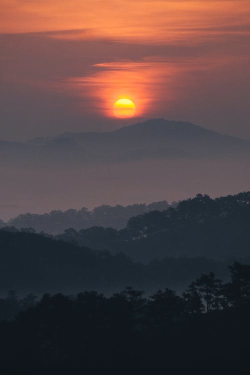 Silhouette of Mountains During Sunrise