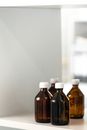 Brown Glass Bottle on White Table