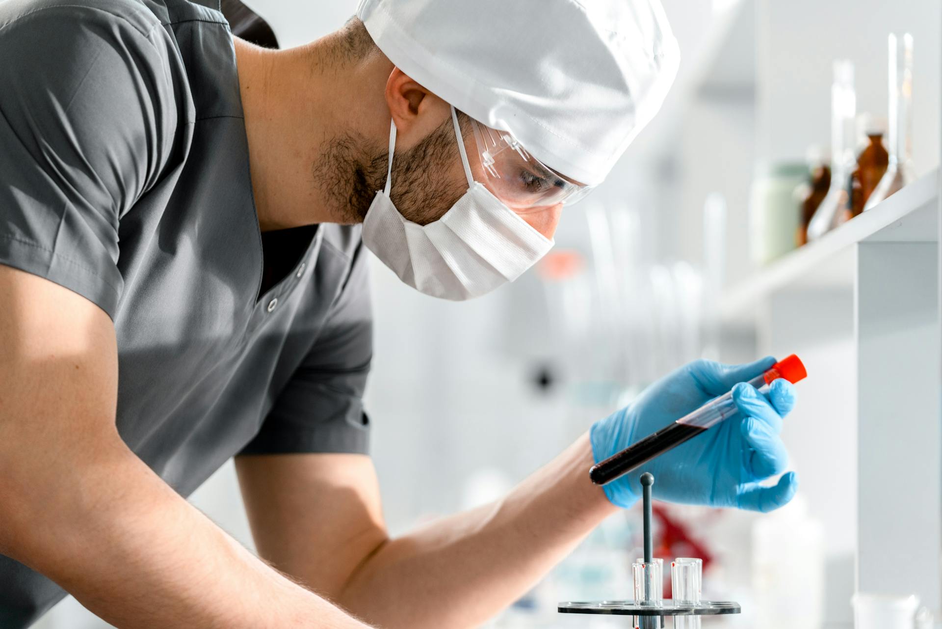 A Man Holding a Test Tube