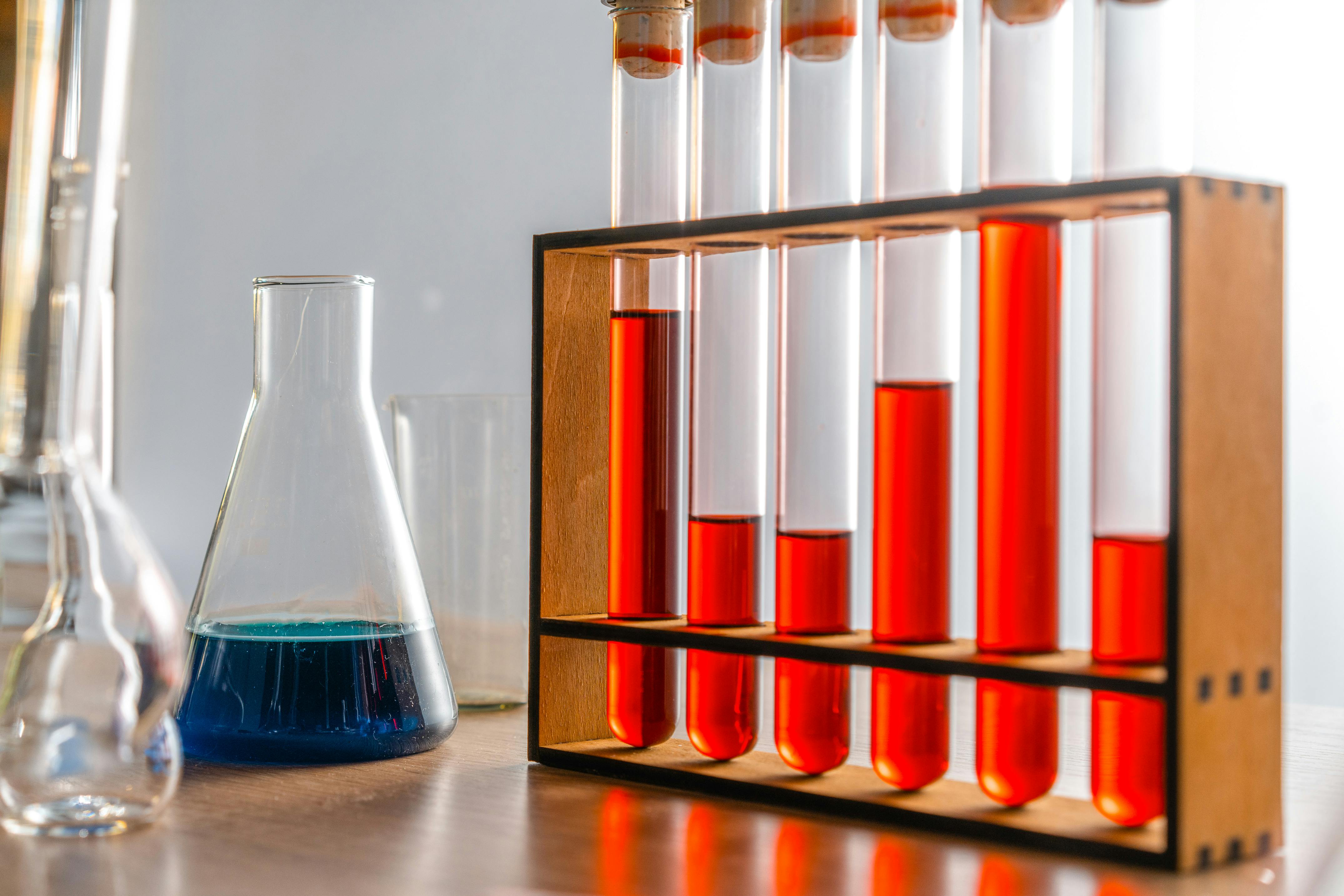 test tubes with colored liquid on a rack