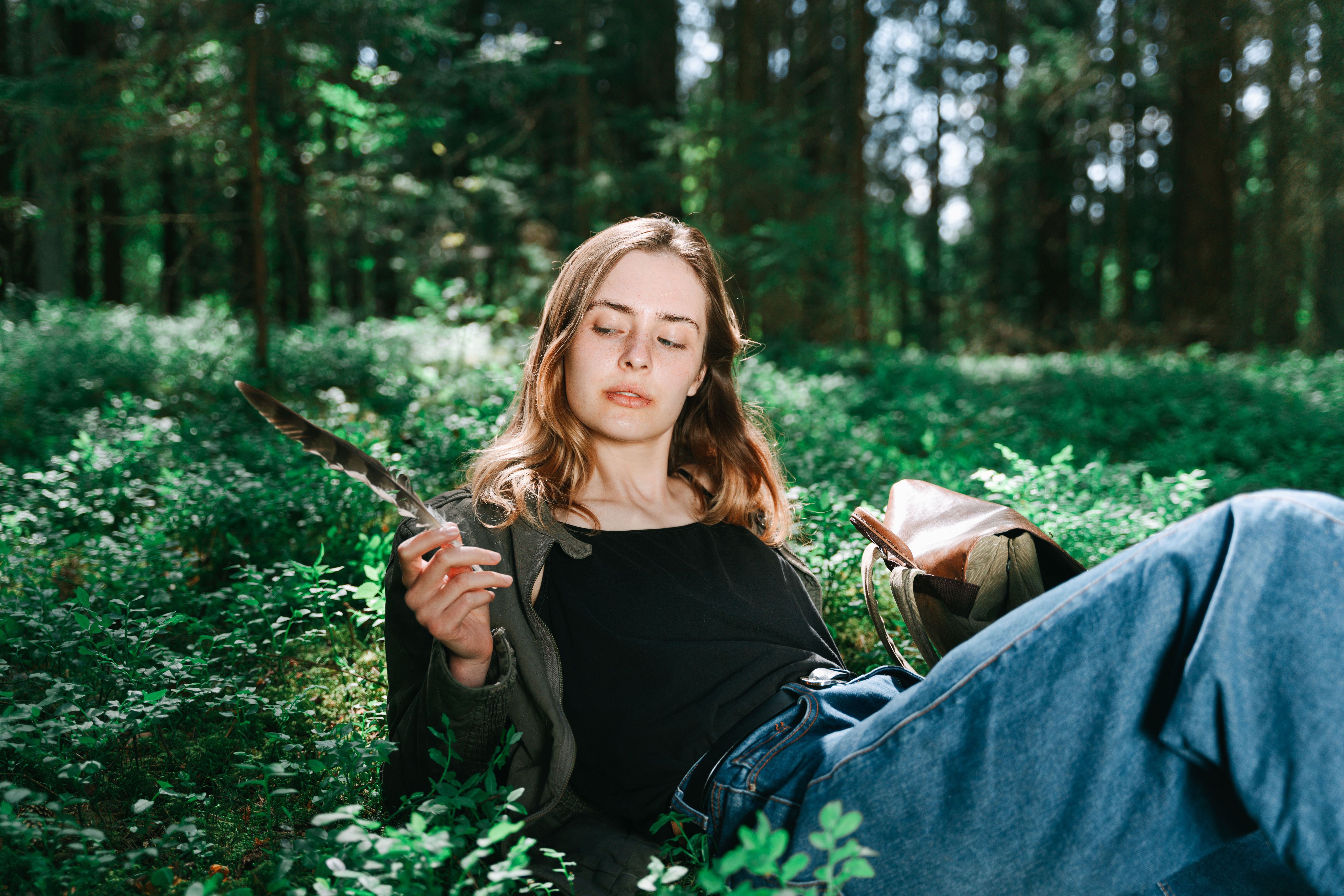 A Woman Sitting on the Grass · Free Stock Photo