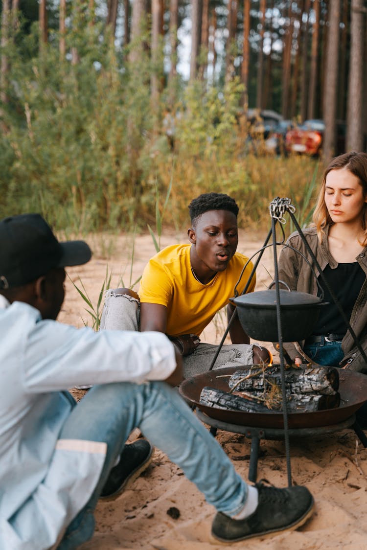 Friends Sitting Around A Campfire