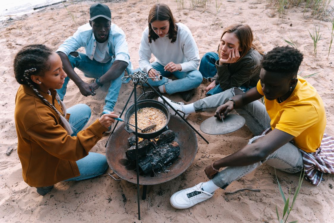 Cooking Using Sand People Sitting on Sand While Cooking Food Β· Free Stock Photo
