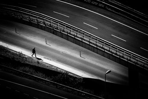 Person Walking on Sidewalk