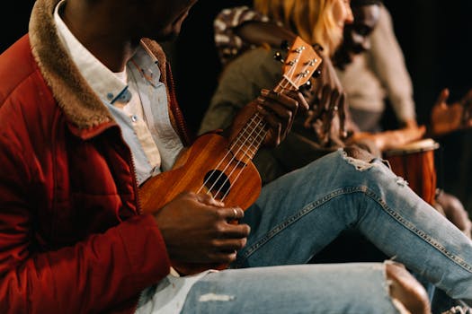 A group of diverse musicians enjoying a jam session with ukulele and drums.