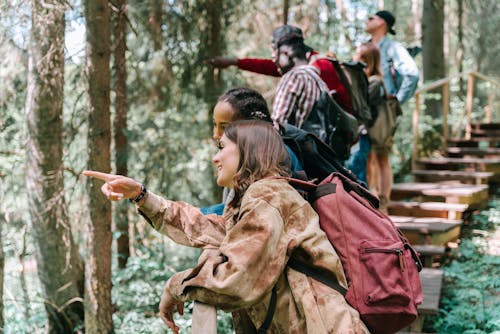 People Standing on Wooden Stairs