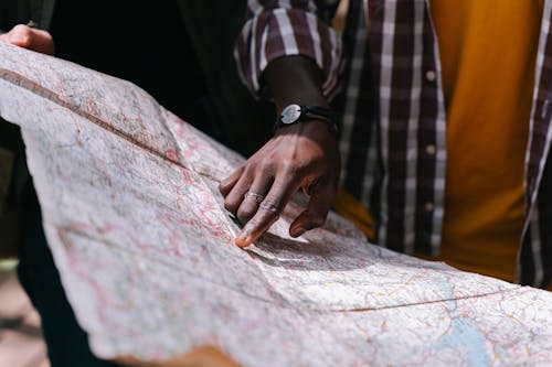 A Person Pointing a Map