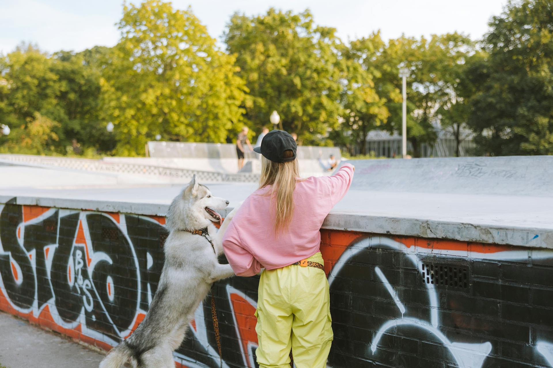 Woman with Husky at Skatepark