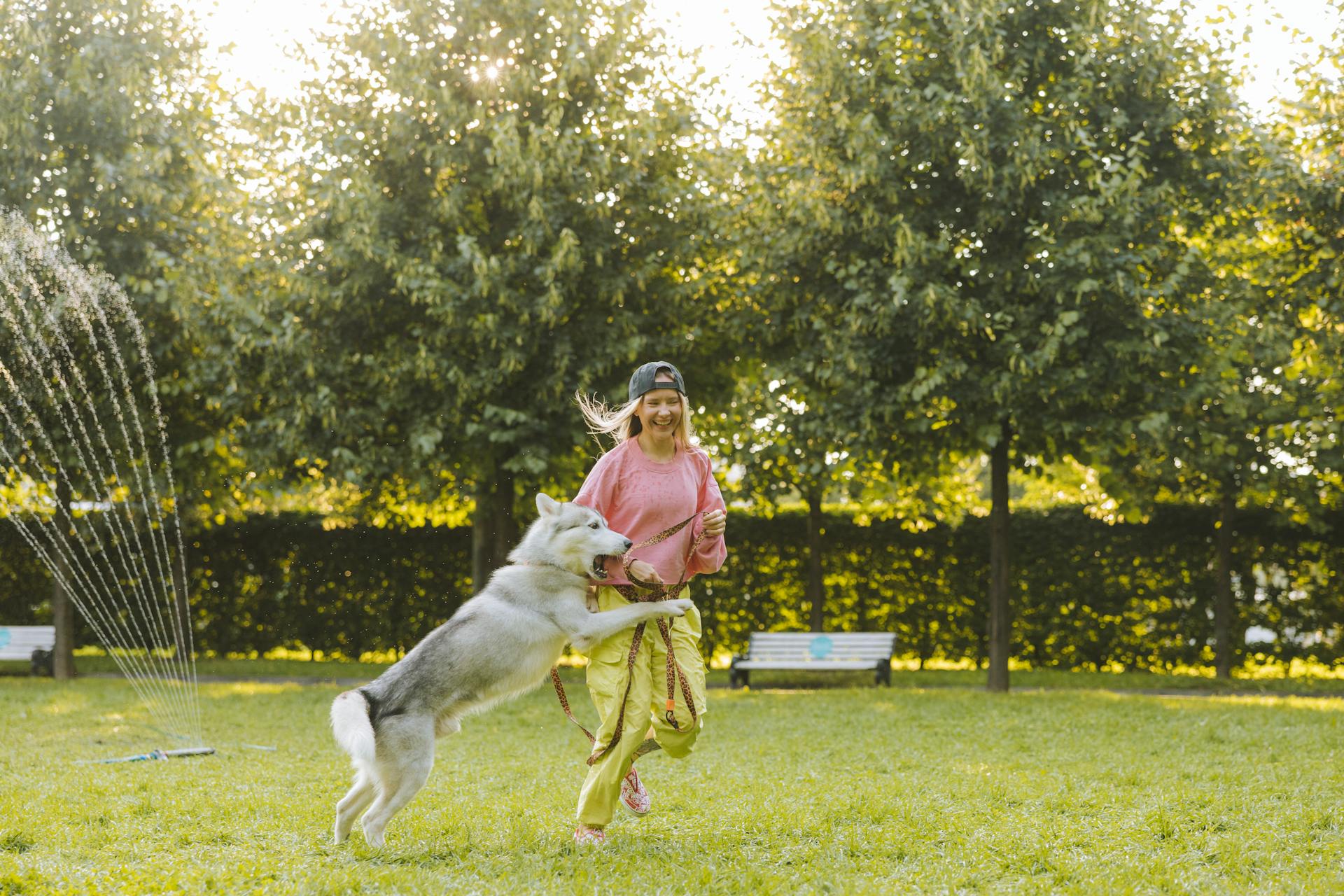 Woman Plying with Her Dog