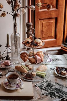 Bread on White Ceramic Plate Beside White Ceramic Mug on Brown Wooden Table
