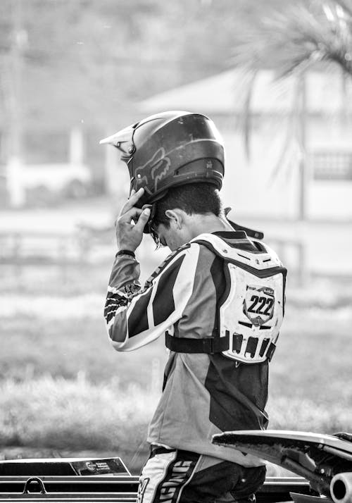 Monochrome Shot of a Man Wearing a Helmet