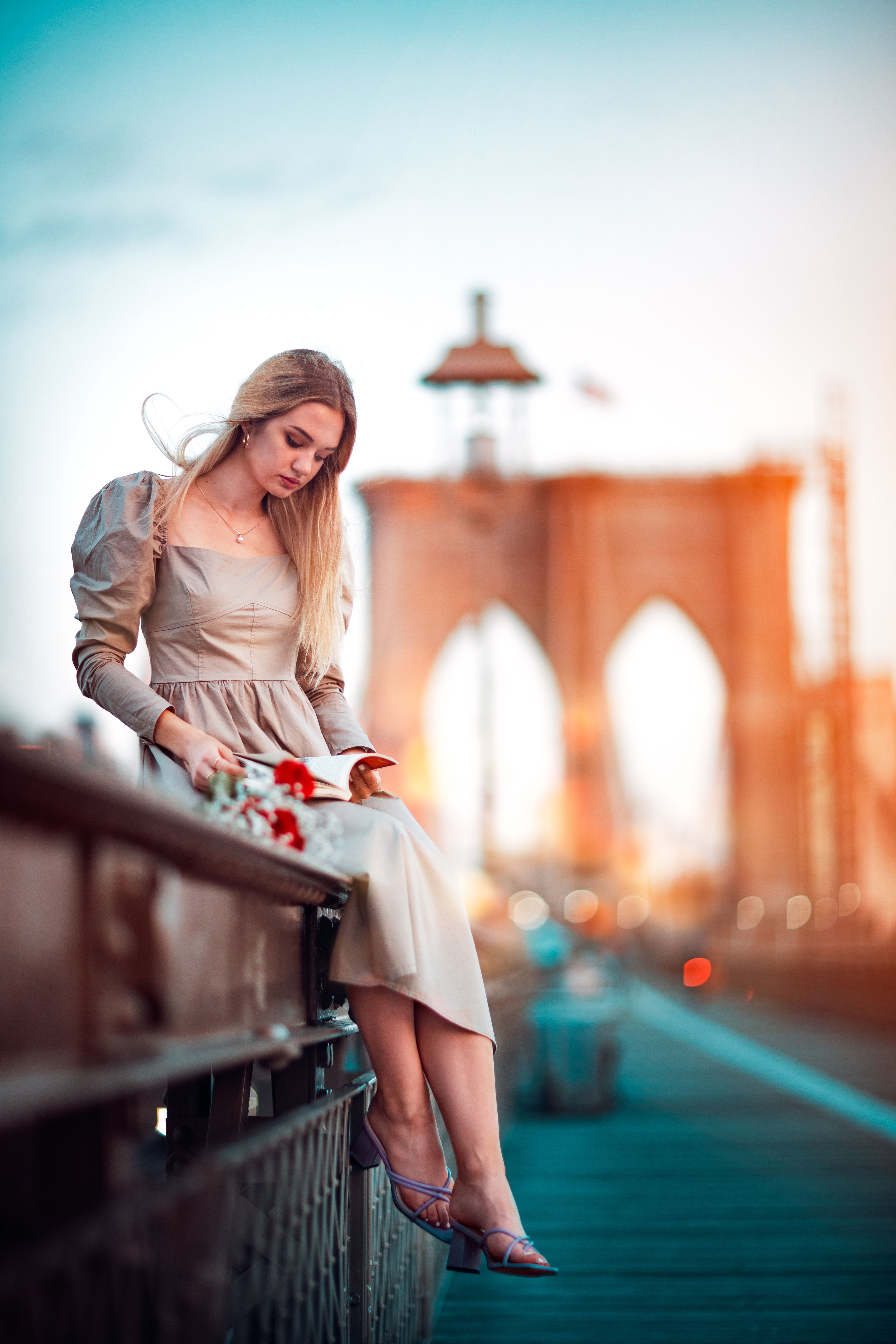 A Woman Sitting on the Metal Railings · Free Stock Photo