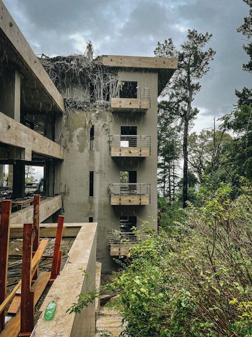 A Concrete Abandoned Building with Ruined Roof Top