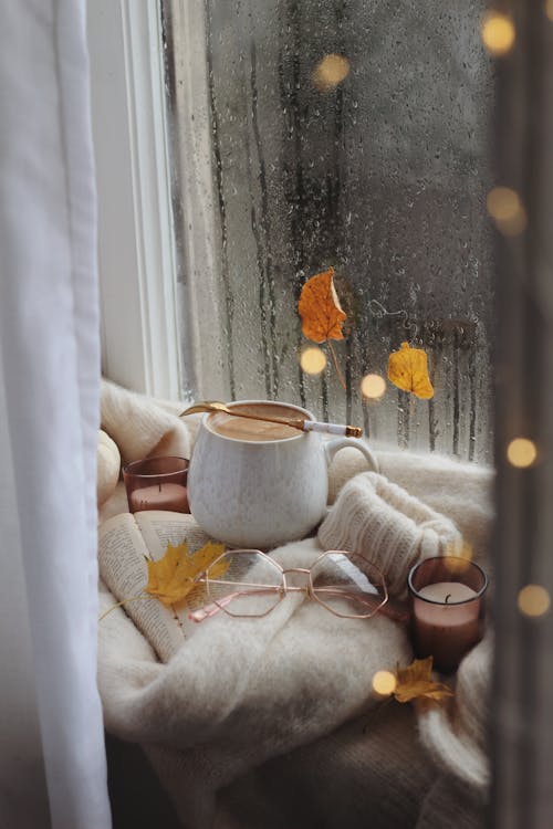 Free Coffee, glasses and sweater on book in autumn scene Stock Photo