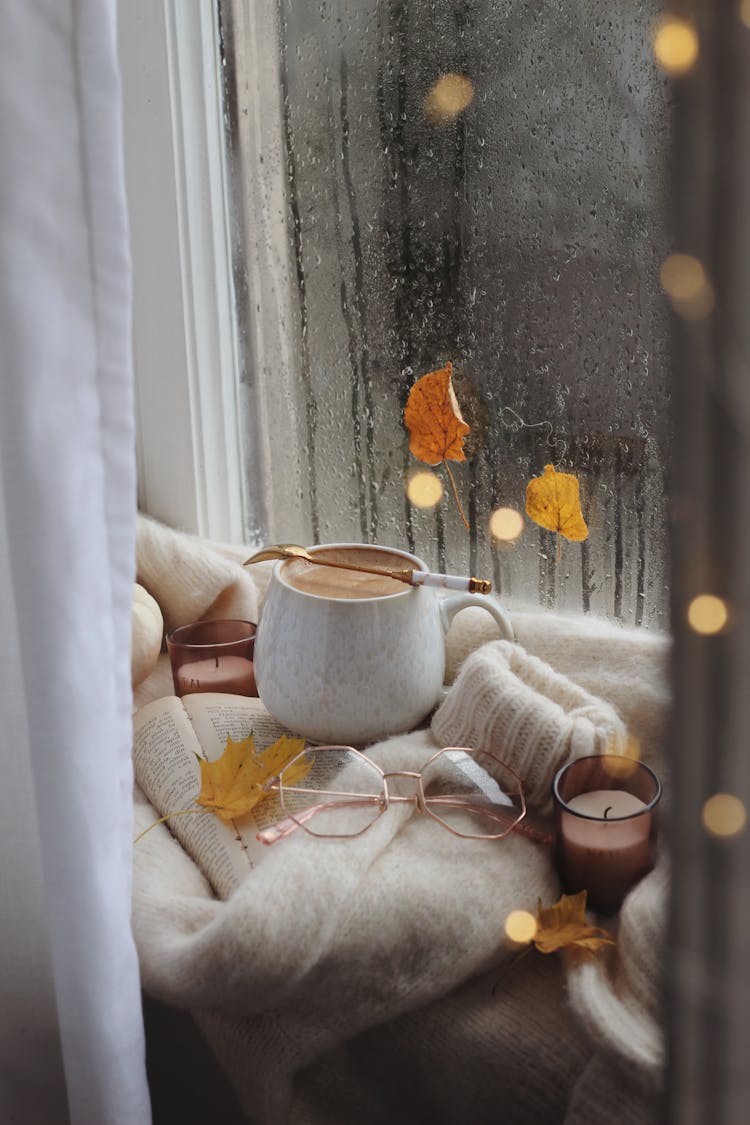 Coffee, Glasses And Sweater On Book In Autumn Scene