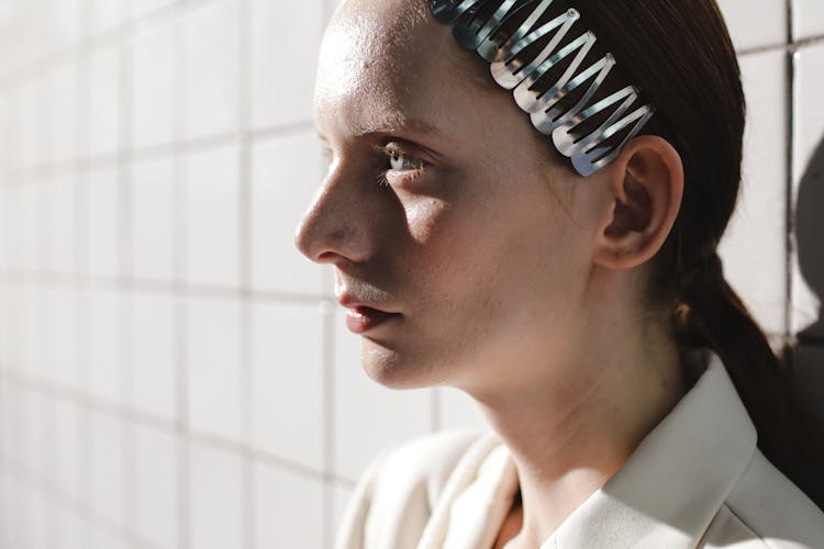 Portrait Of Serious Woman Wearing Hair Clips