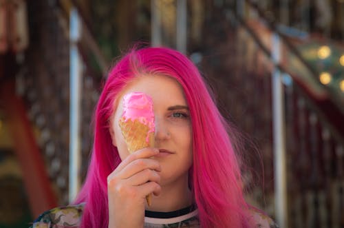 Close Up Photo of a Woman Holding an Ice Cream Cone