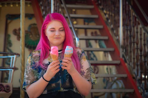 Pink Haired Woman Holding Ice Cream Cones 