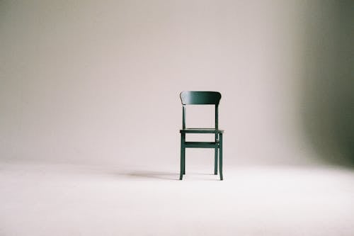 Wooden Chair on a White Wall Studio 