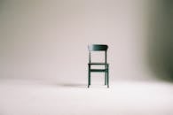 Wooden Chair on a White Wall Studio