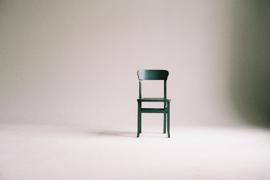 Green Wooden Chair on White Surface