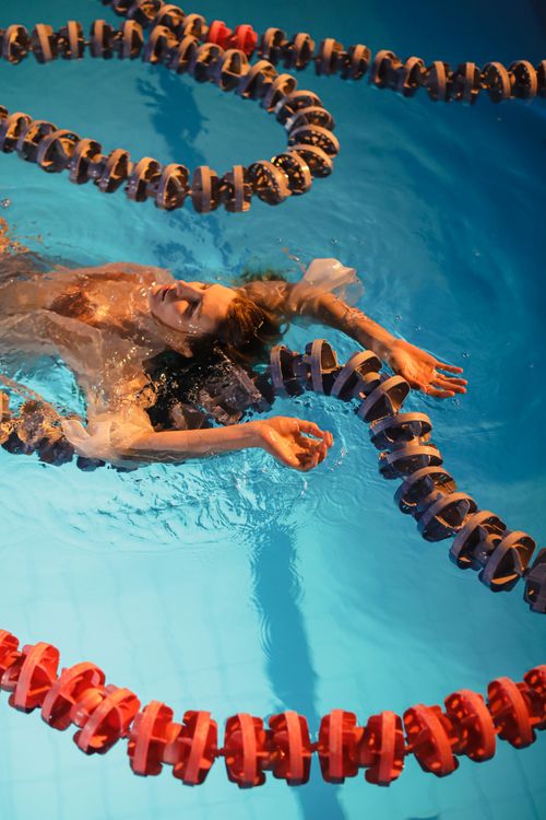 Woman Floating in a Pool · Free Stock Photo