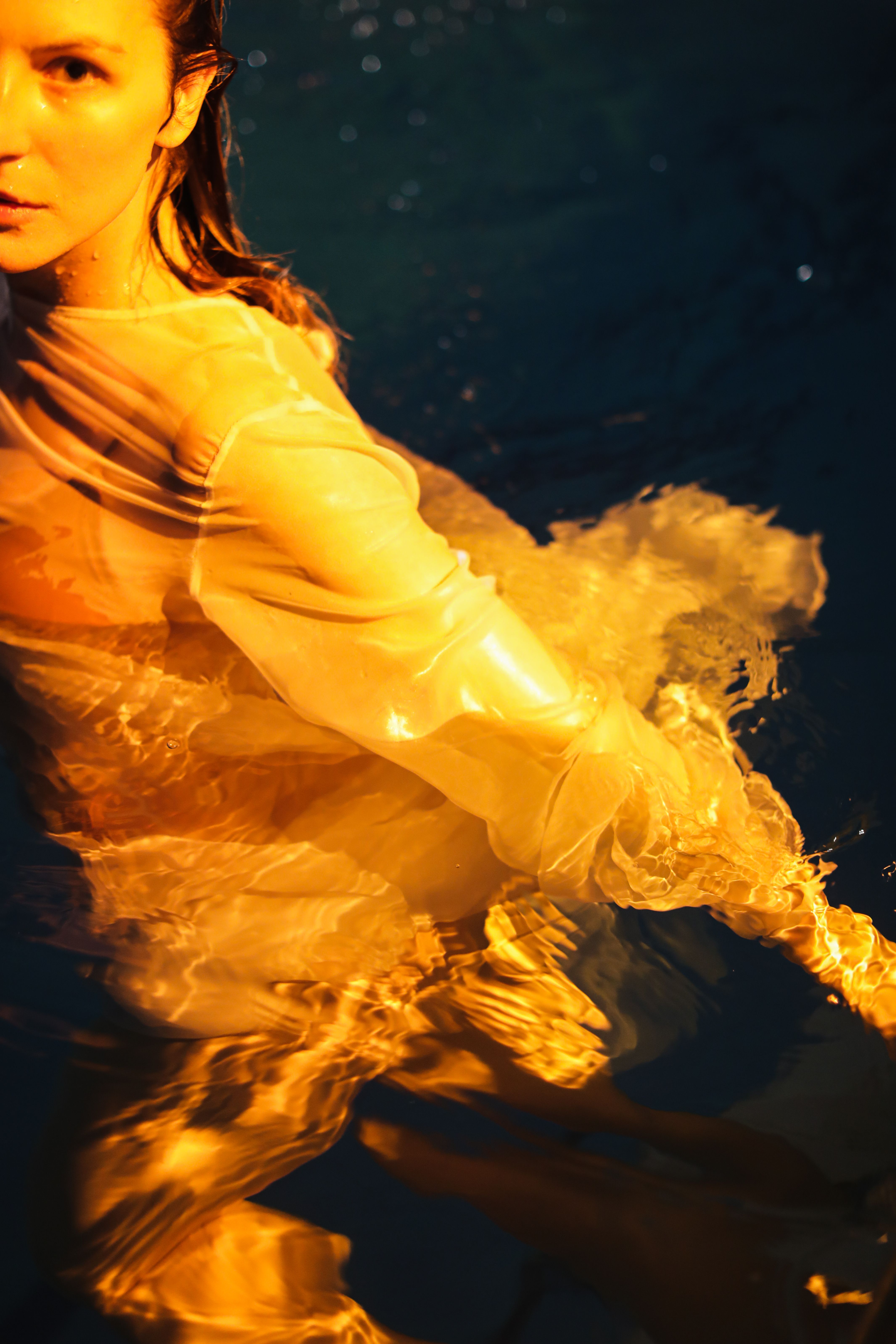 A Woman Wearing a Dress on the Water · Free Stock Photo