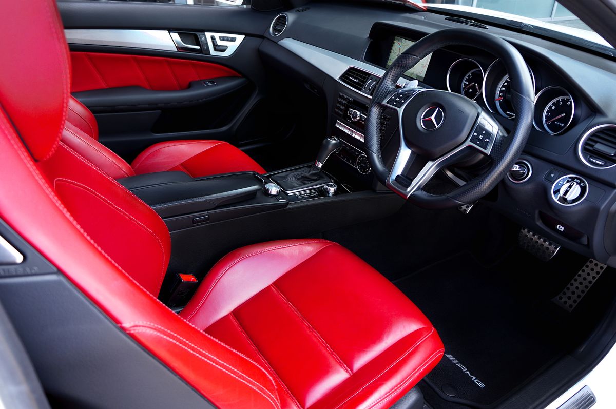 Red and black premium car interior representing quality car accessories in Vashi