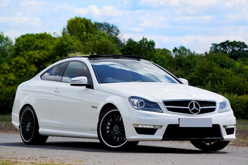 Free White Mercedes Benz Coupe on the Road Stock Photo