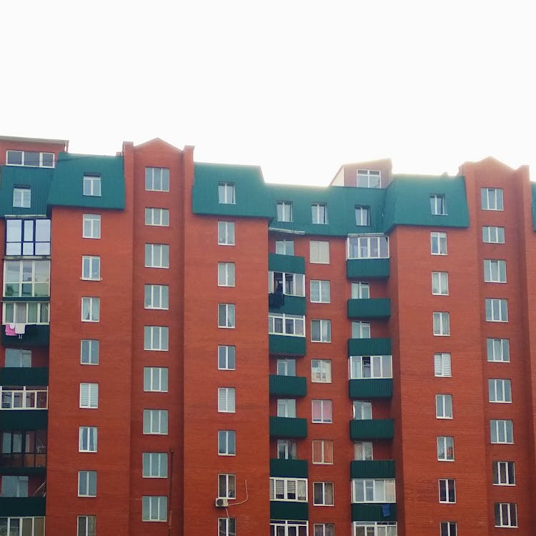 Modern Block Of Flats With Green Roof And Balconies