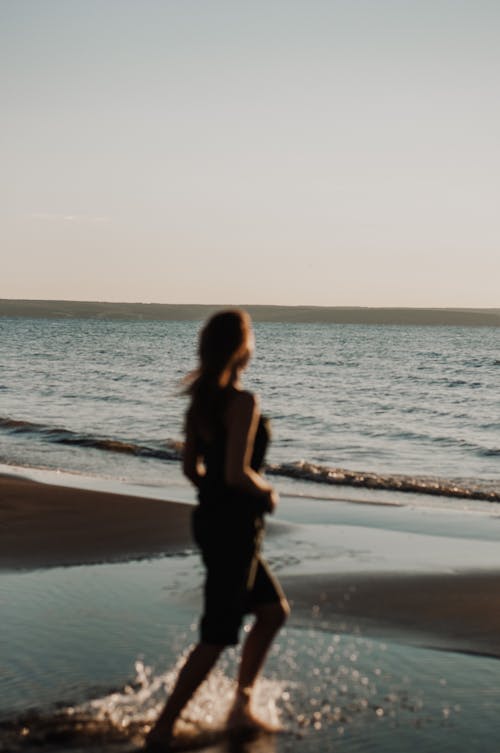 Woman running on beach 