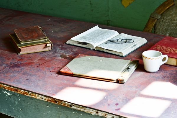 Open book and reading glasses on a worn desk, photo by Brett Sayles on Pexels