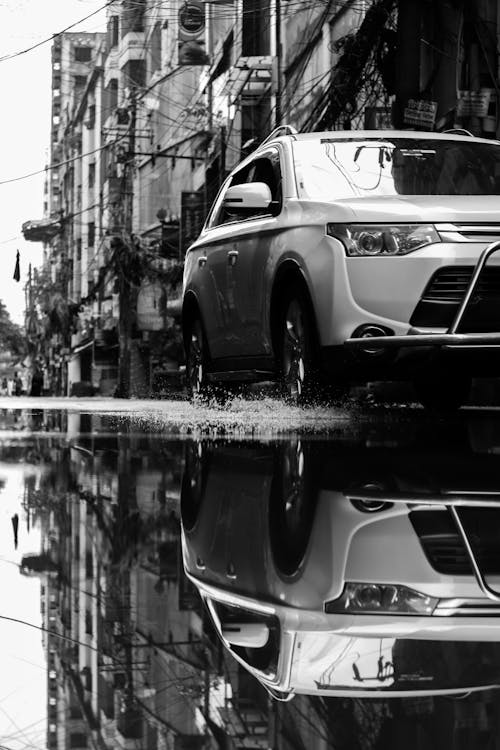 Free Grayscale Photo of Car's Reflection in a Puddle  Stock Photo