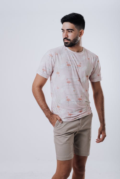 Free Man in White Crew Neck T-shirt and Gray Pants Stock Photo