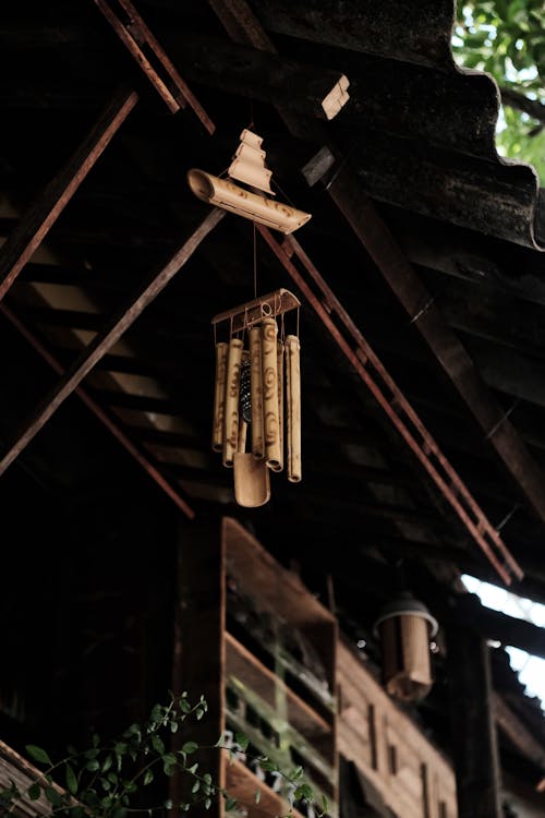 Free Brown Wooden Wind Chime on Brown Wooden Ceiling Stock Photo