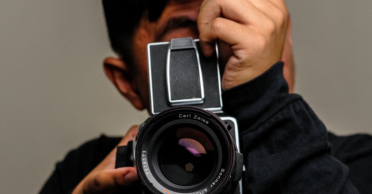Person Image Using Camera A Person using a Camera · Free Stock Photo