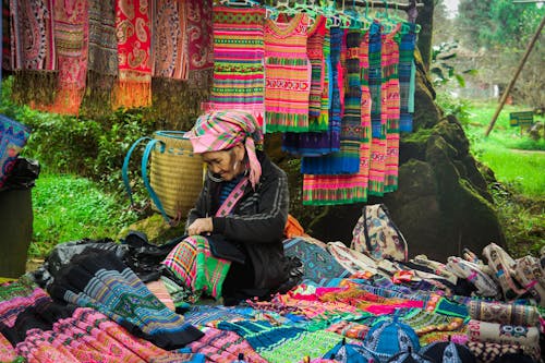 Elderly Woman selling Traditional Fabric 