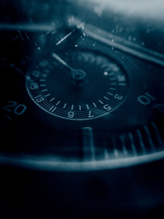 Macro of a deep teal diver dial with painted minute track — jerin mathew on Pexels