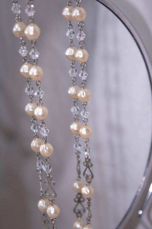 Free Close-up Photo of Pearl Necklace on a Mirror  Stock Photo