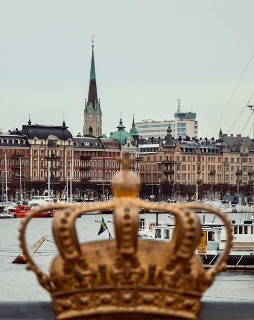 Free The Golden Crown Glided in Skeppsholmen Bridge in Stockholm, Sweden Stock Photo